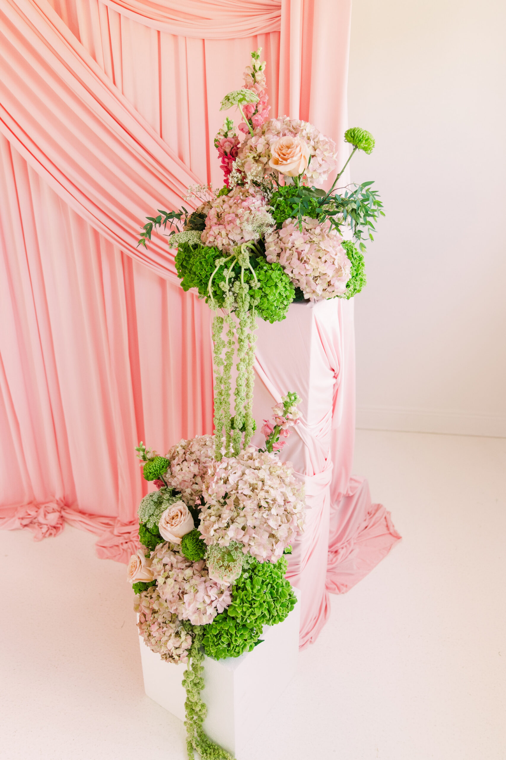 Lush wedding floral installation created by a floral designer for a luxury celebration