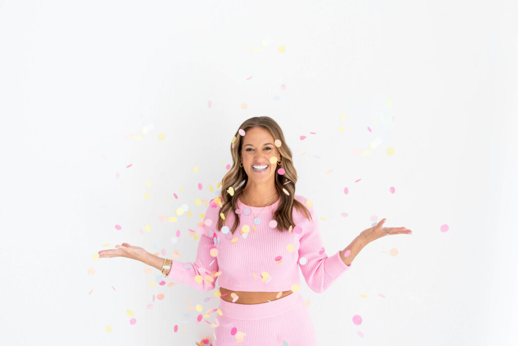 Kathryn of Daydream Sites tossing confetti during her brand photoshoot